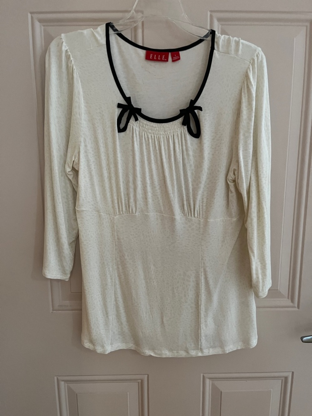Elle Cream /ivory 3/4 Sleeve Scoop Neck Top with Black Trim and Bows